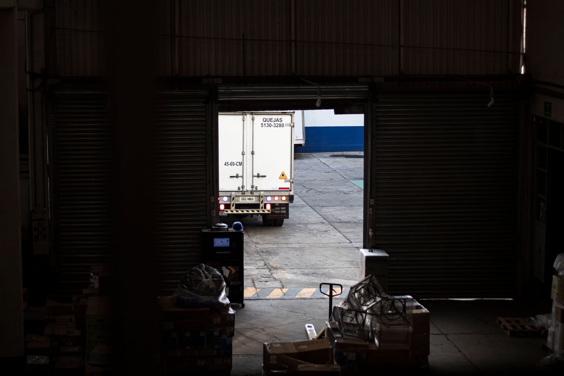Truck departing a warehouse loading dock